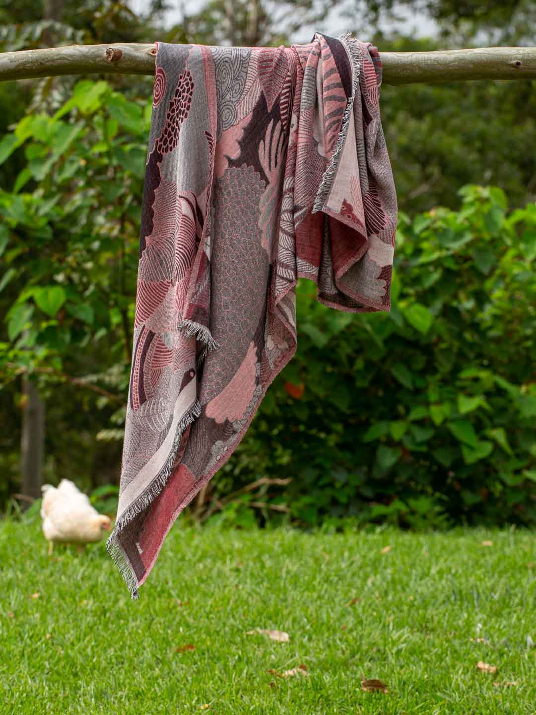 Draped outdoors, wine  and grey abstract jungle pattern scarf