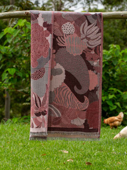 Folded and draped wine and grey abstract jungle pattern scarf