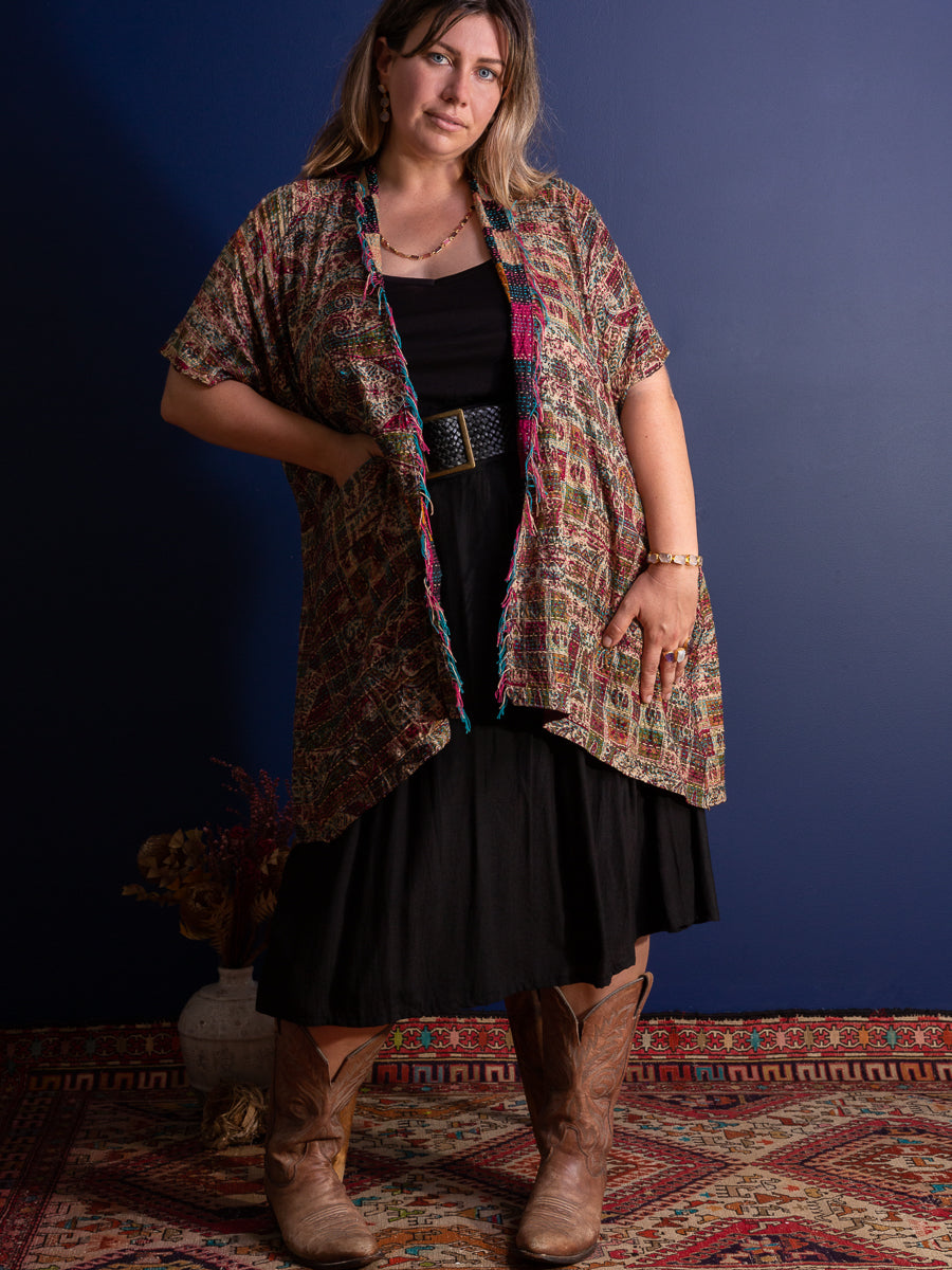 Curvy woman wearing a wide leather belt and boho outfit