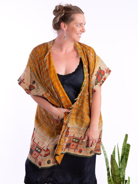 Woman wearing a mustard coloured silk kimono