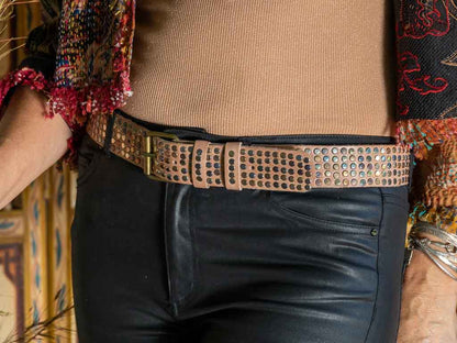 Putty coloured studded belt with black leather jeans