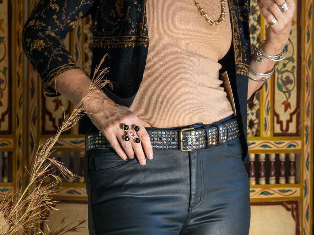 A black studded belt with black leather jeans