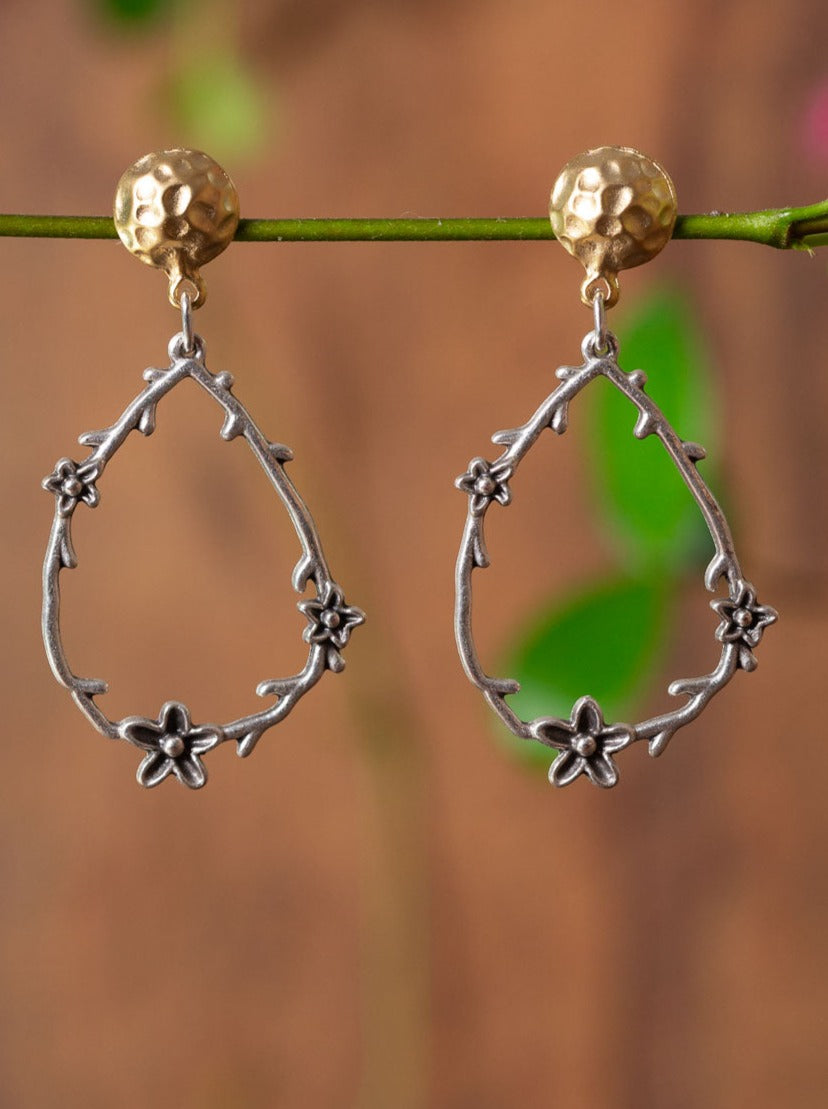 Earrings - Gold stud finding with a silver floral drop.