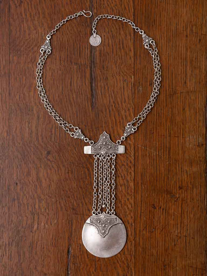 Shemara necklace - a long draping necklace with a detailed orb and dangling chains