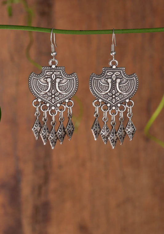 Ama Earring - a stamped peacock design with silver dangles
