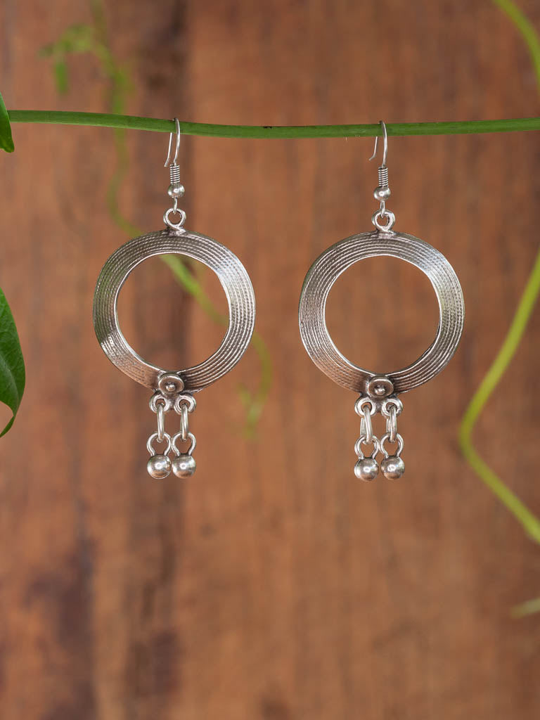 Indi Earring - an engraved circle with bell drops