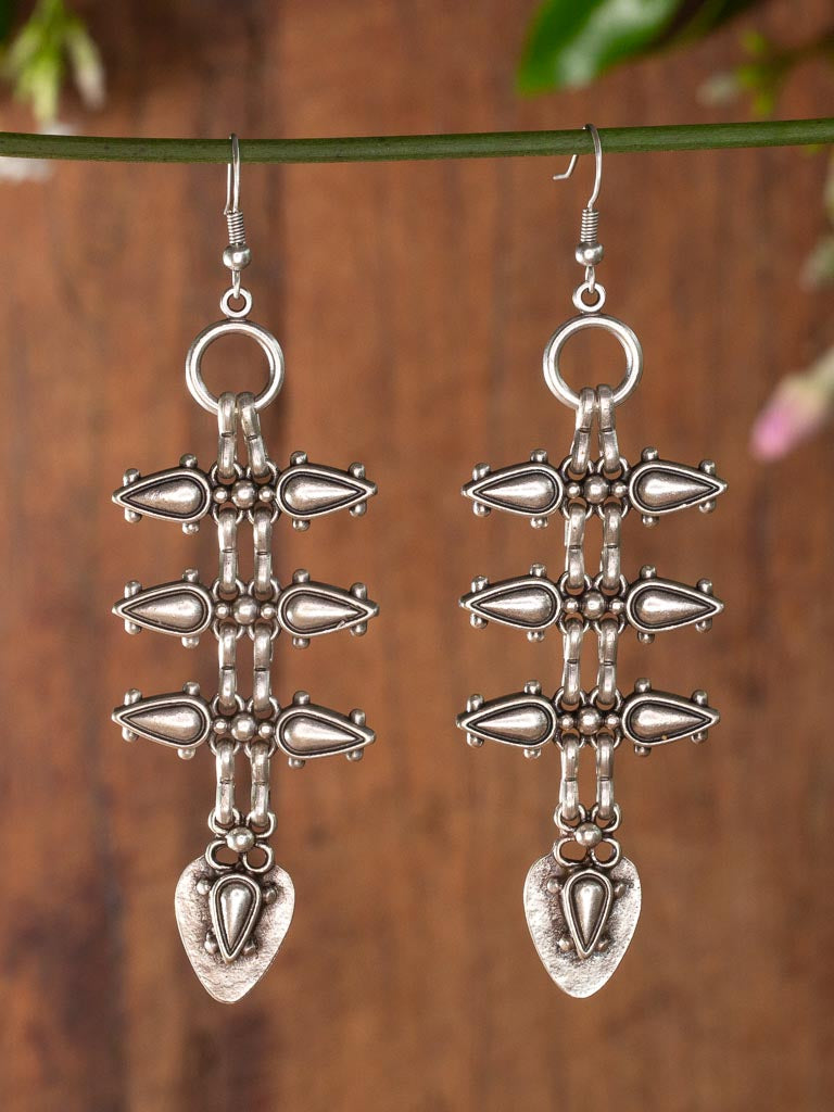 Silver teardrop shaped earring with spikes