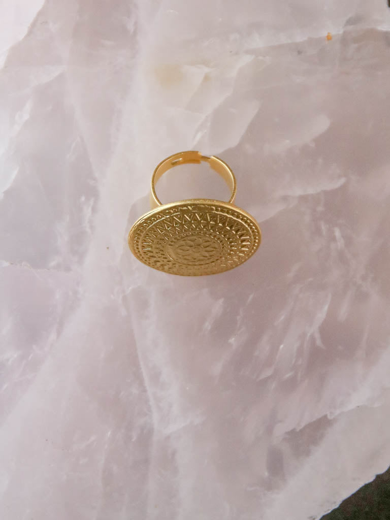 Side view of gold adjustable ring