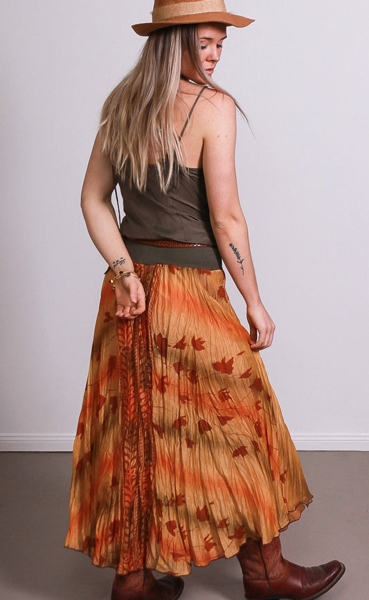 Lady wearing autumn leaves skirt