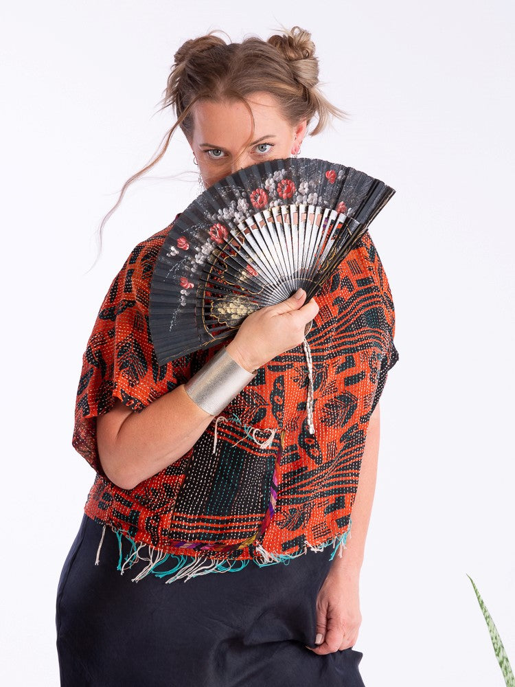 Woman with a silk kantha silver cocoonz top and fan