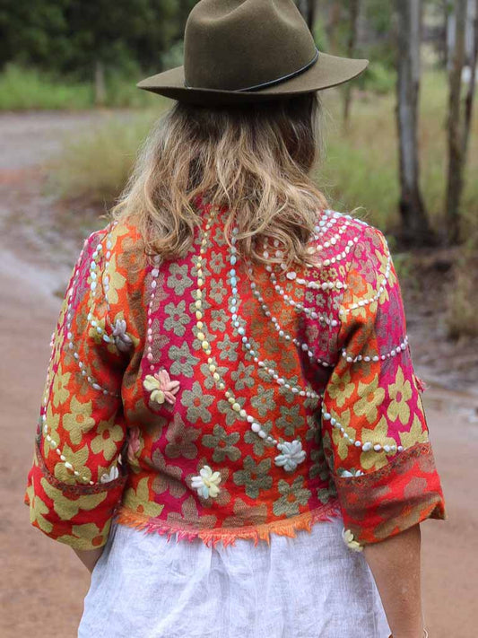 Fringed wool jacket in orange with daisies - back view