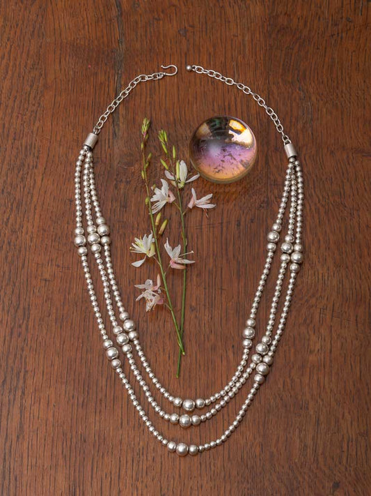 A three strand bauble necklace
