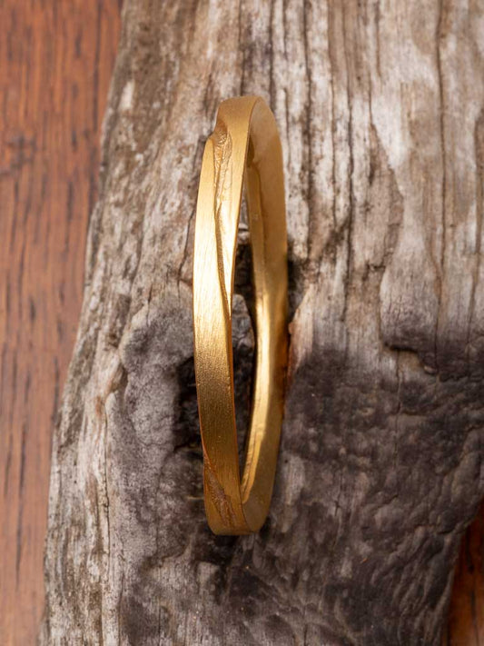 Gold Sheba Bangle - a solid round bangle with etched design
