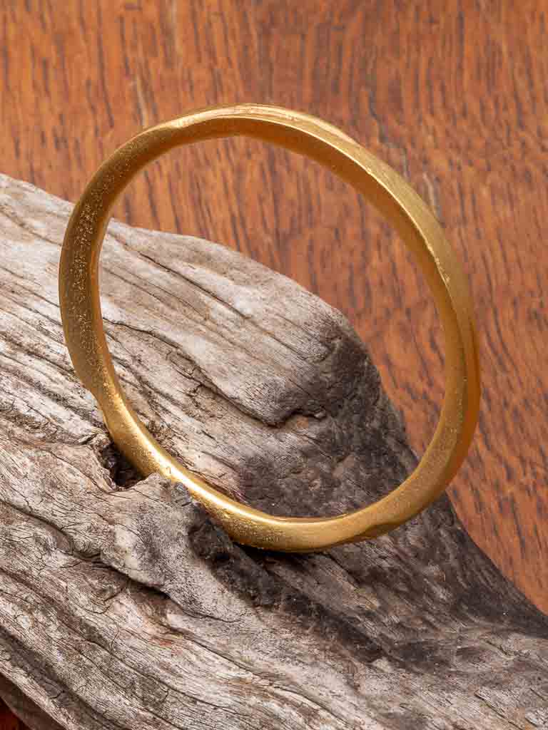 Gold Sheba Bangle - a solid round bangle with etched design