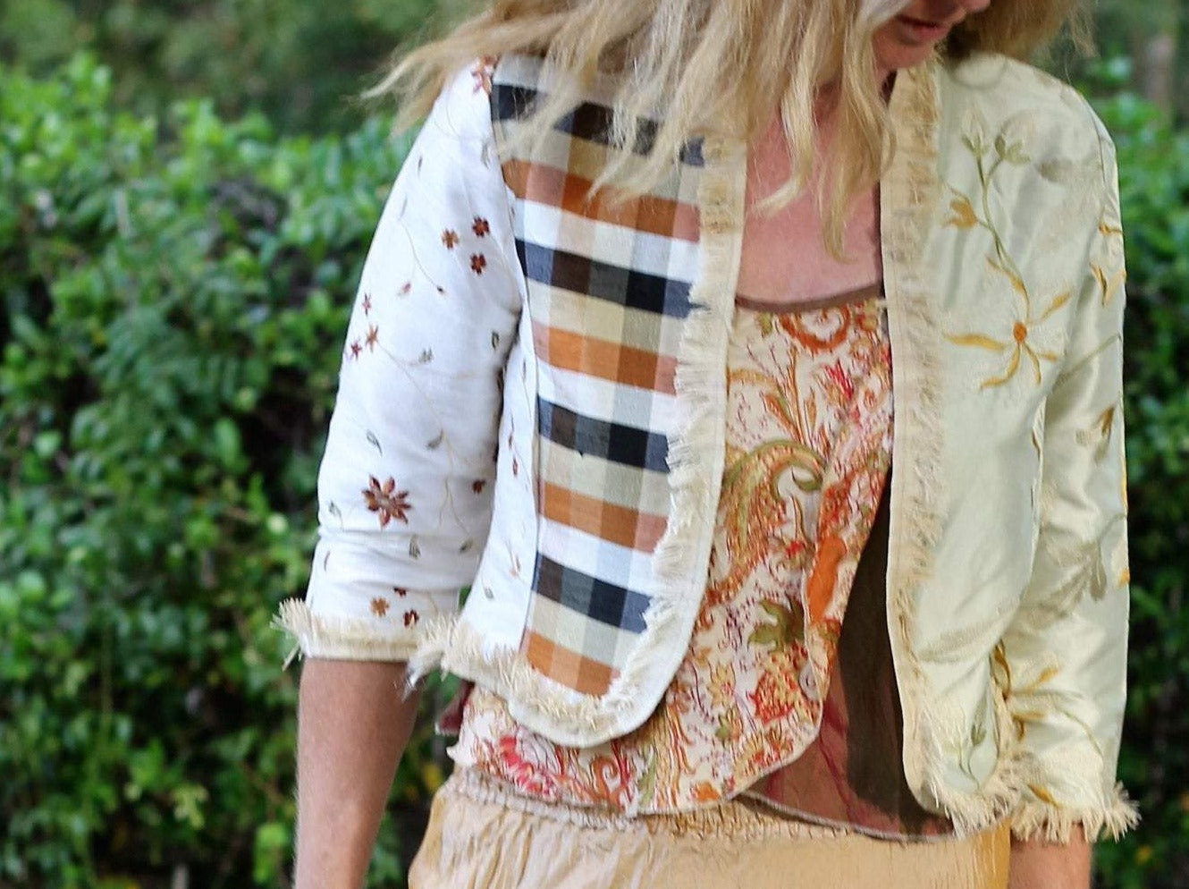 A satin jacket with cream checks and embroidery