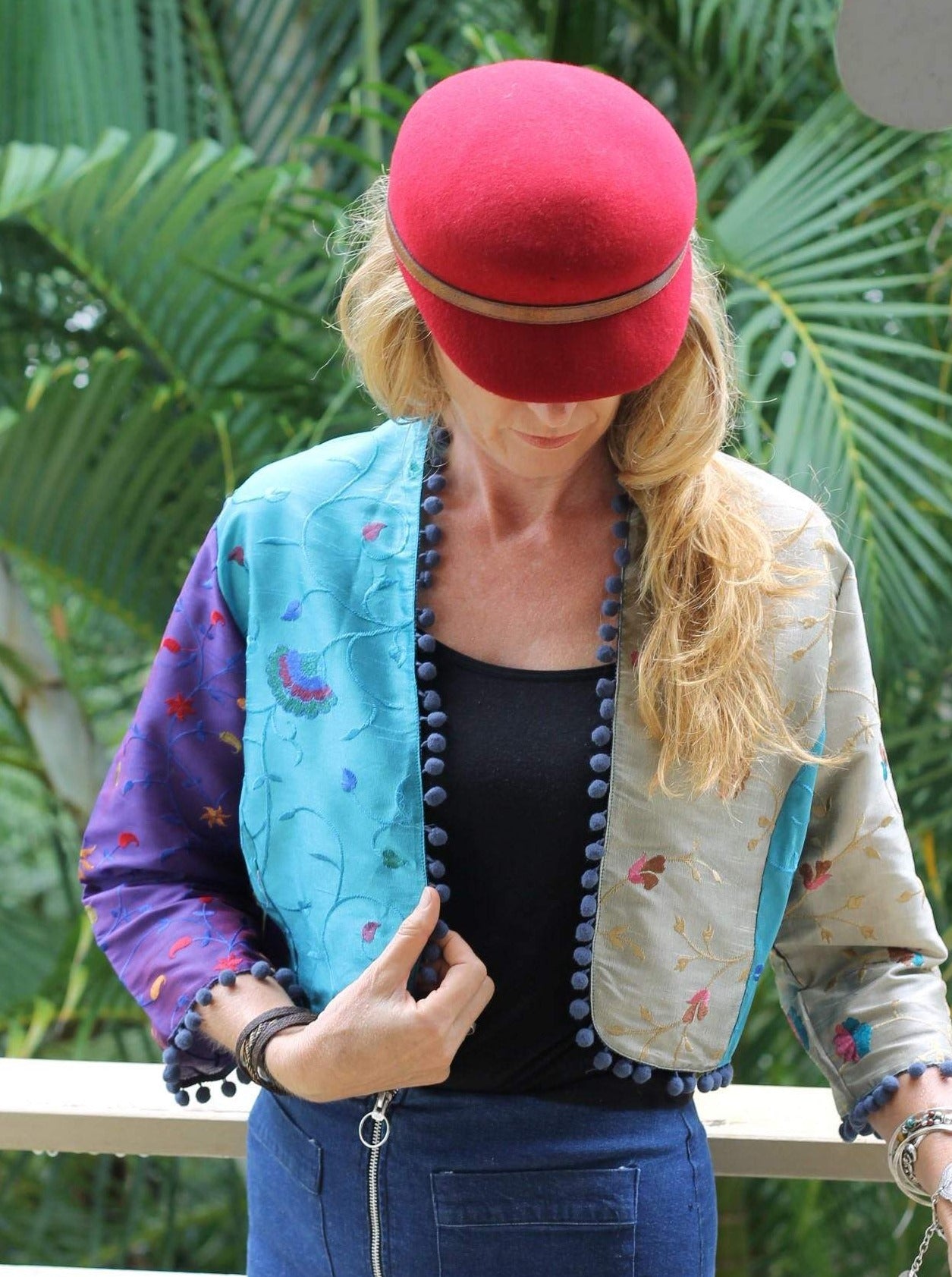 Pom poms on a silk jacket
