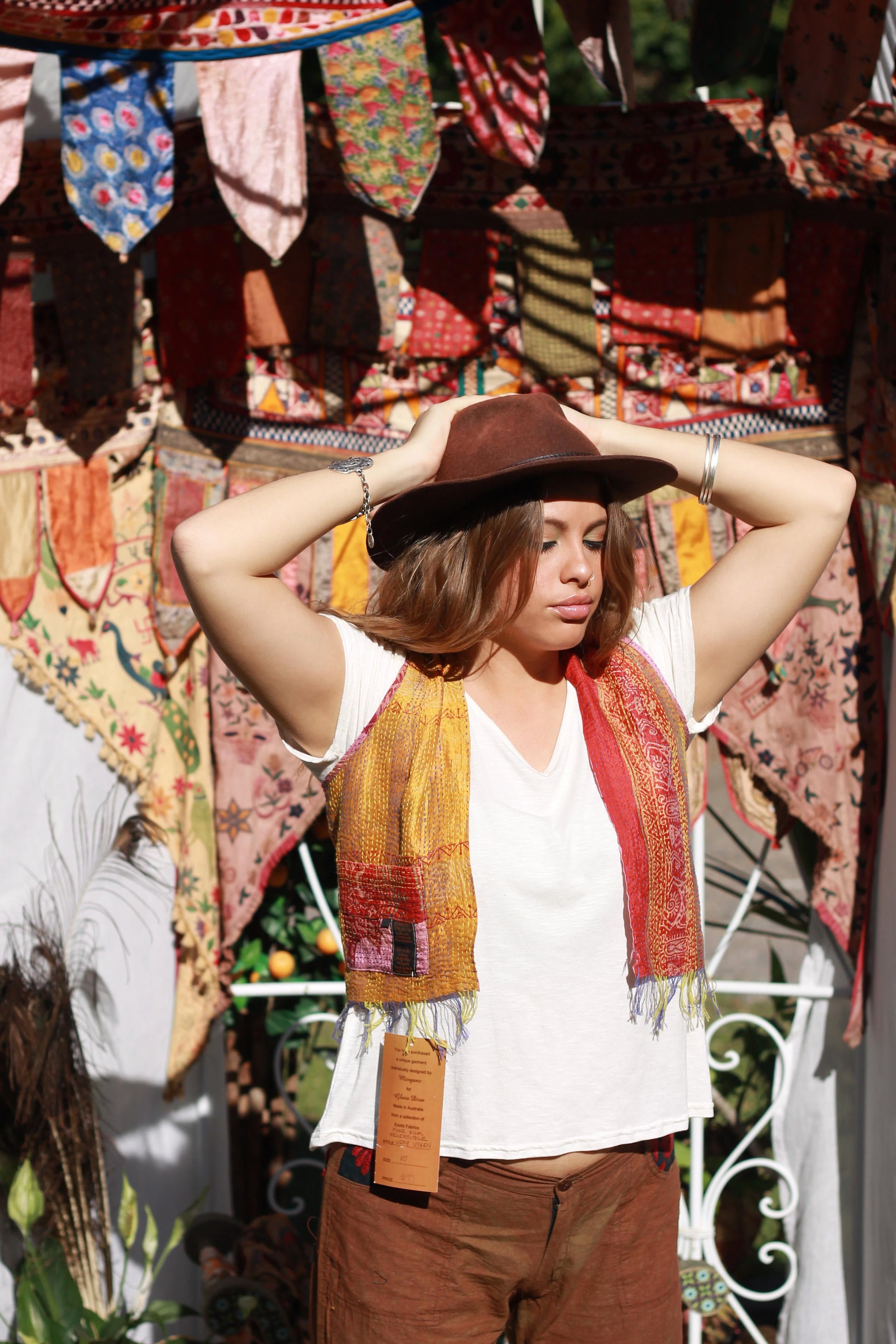 Front view of woman in t-shirt and silk vest in yellow and red