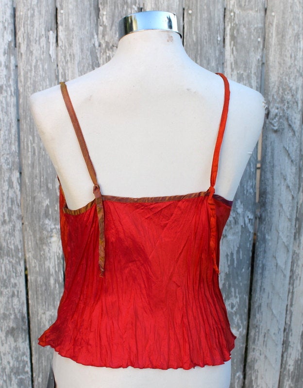 Back view of a silk cami in orange