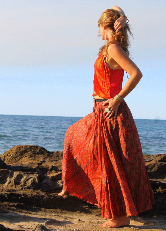 Lady on the beach in boho outfit