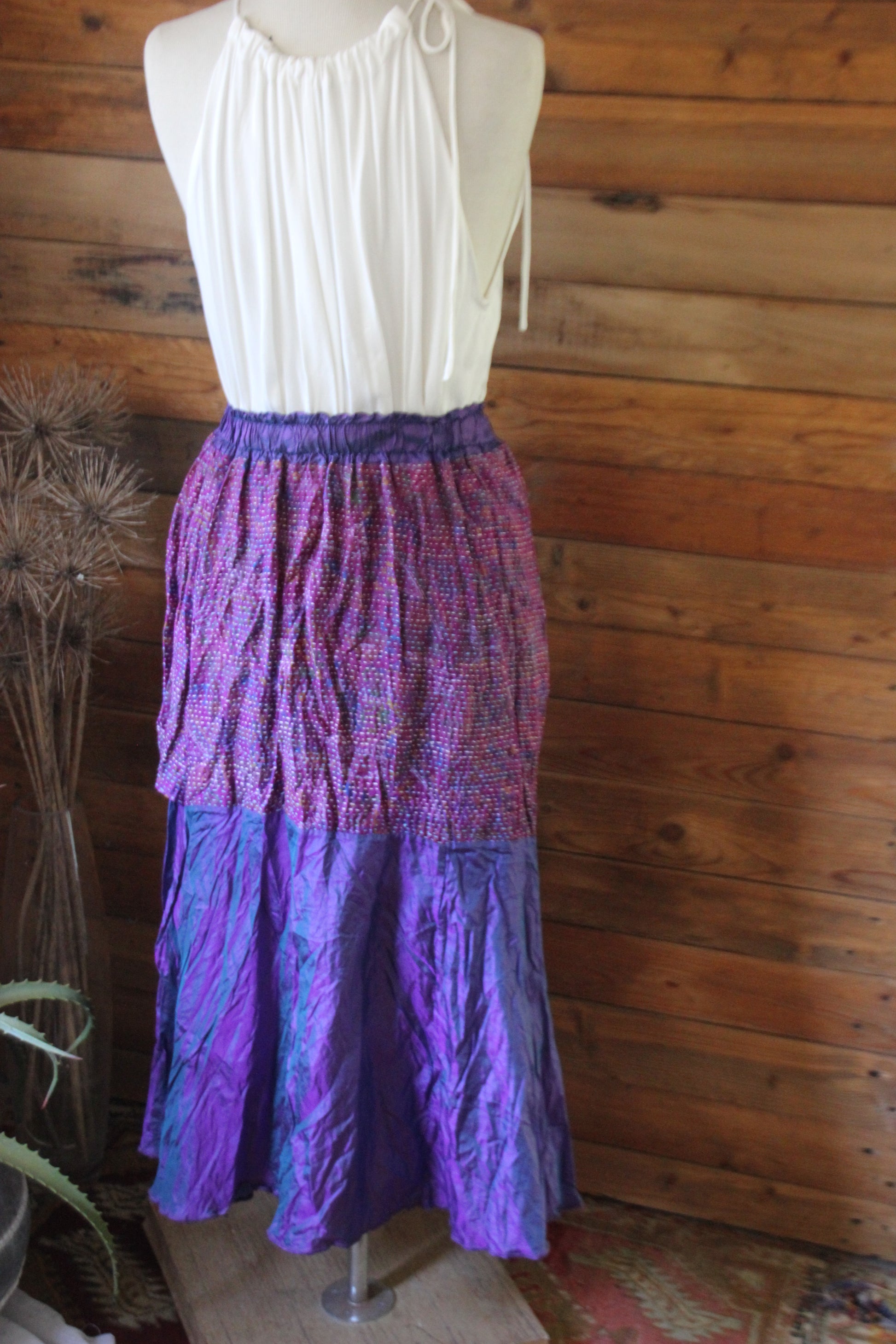 Rear view of purple silk skirt with kantha trim