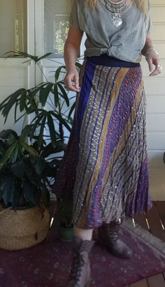 Lady wearing a silk sari skirt in royal blue with sequins