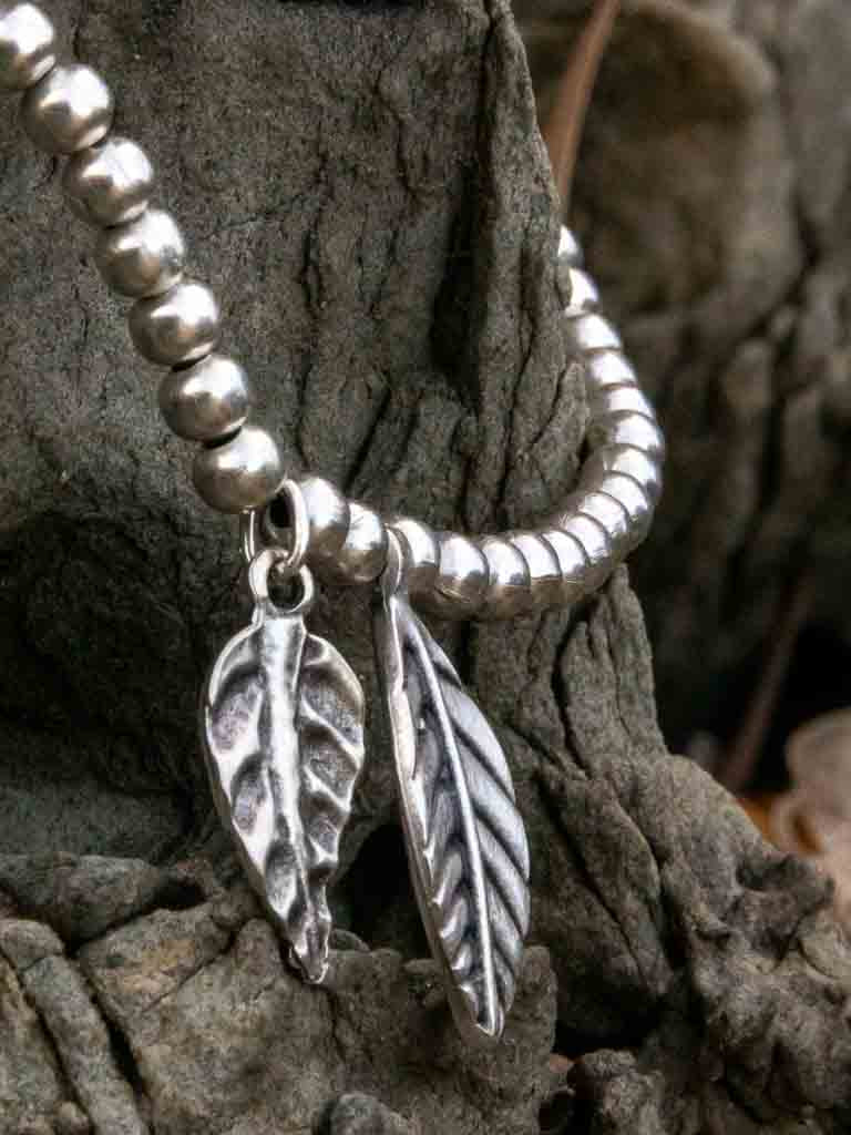 Carly Anklet - a silver ball chain with feather charms and adjustable chain link