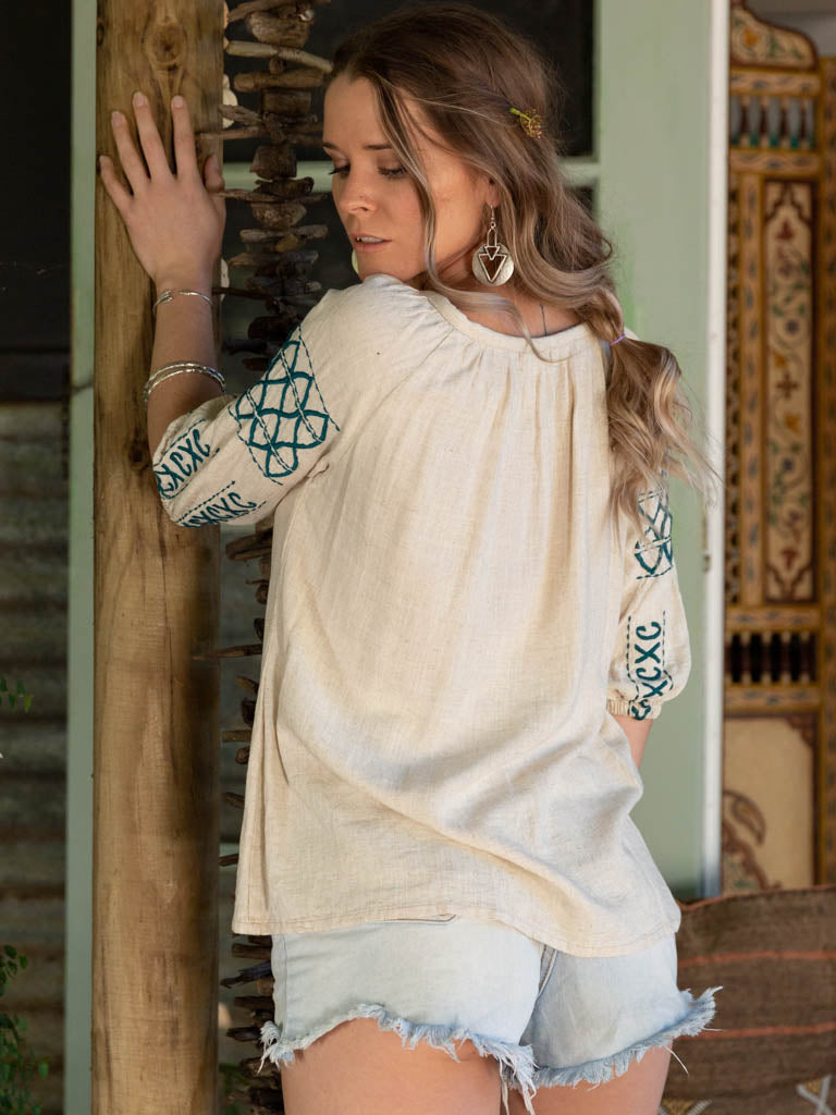 Lady in peasant top and silver tfa tribal earrings