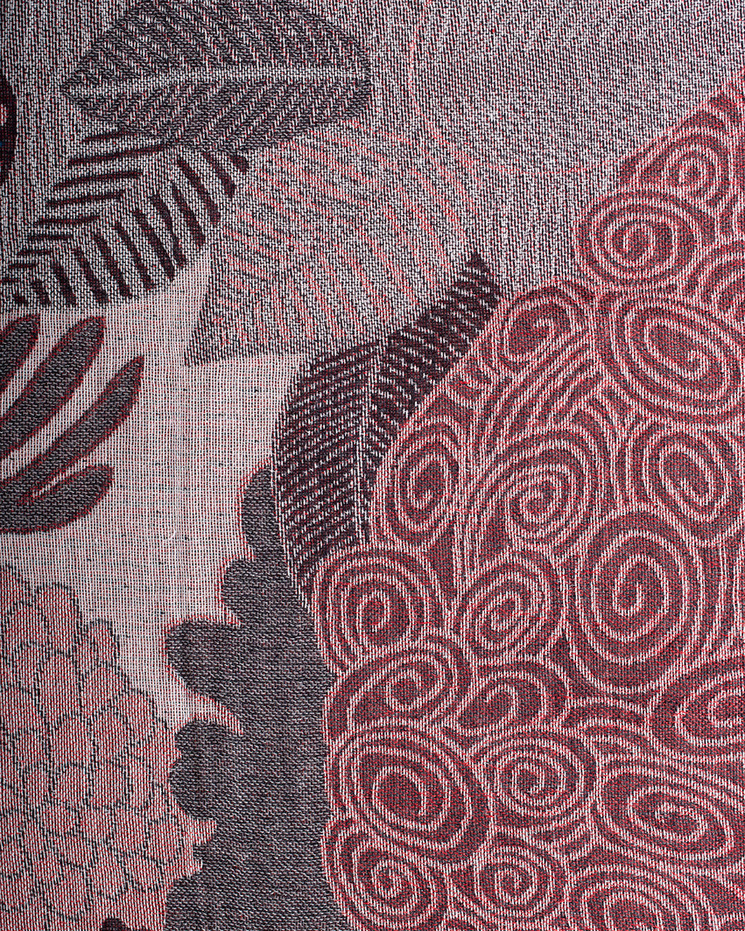 Close up detail of  wine and grey abstract jungle pattern scarf