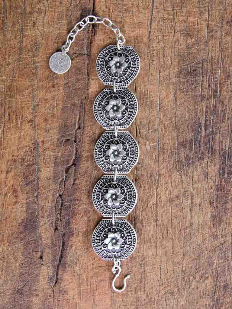 Fatima Bracelet Stamped "shields" with flower design joined with chain links and an adjustable chain closure.
